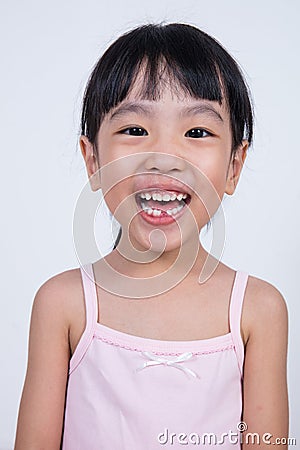 Happy Asian Chinese little girl with toothless smile Stock Photo