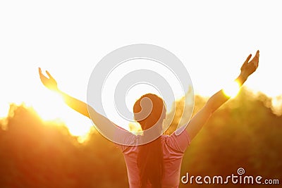 Happy Asian Chinese woman embrace nature and sun Stock Photo