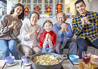 Happy asian family having dinner and celebrating chinese new year at home Stock Photo