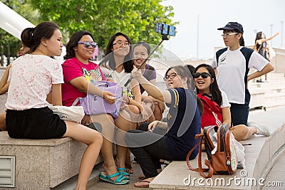 Happy Asian girls taking selfie in Singapore Editorial Stock Photo