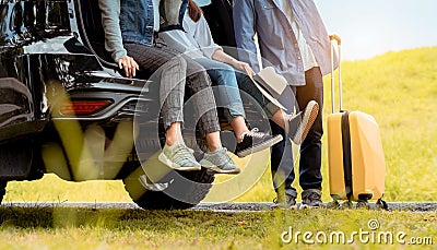 Happy asian group of friends with car travel driving and suitcase at mountain road Stock Photo