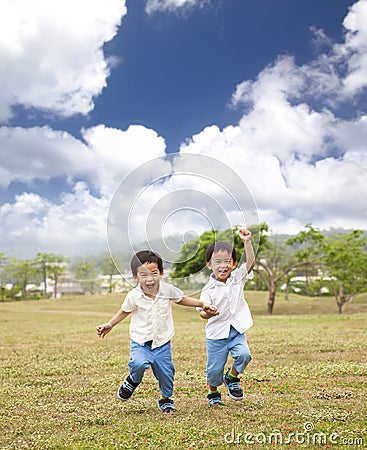 Happy asian kids running Stock Photo