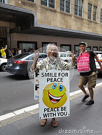 Happy Asian man in sandwich-board and guy photobombing Editorial Stock Photo