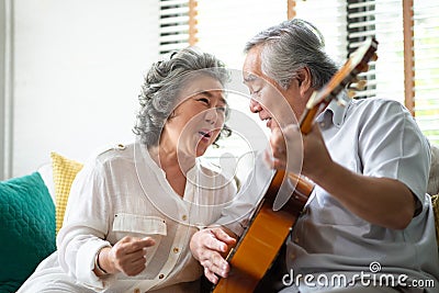 Happy Asian senior Couple enjoying Stock Photo