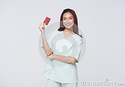 Happy asian woman patient showing credit card isolated on white background. Insurance allowance and charge indemnification concept Stock Photo