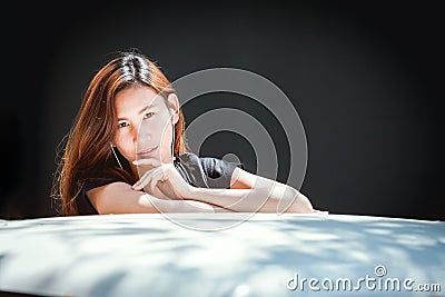 Happy asian youth teenage listening music on cellphone Stock Photo