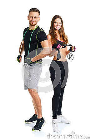 Happy athletic couple - man and woman with with ropes on the white Stock Photo