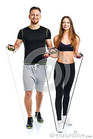 Happy athletic couple - man and woman with with ropes on the white Stock Photo