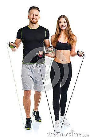 Happy athletic couple - man and woman with with ropes on the white Stock Photo