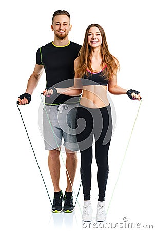 Happy athletic couple - man and woman with with ropes on the white Stock Photo