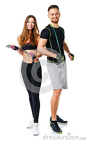 Happy athletic couple - man and woman with ropes on the white Stock Photo