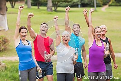 Happy athletic group holding up their fist Stock Photo