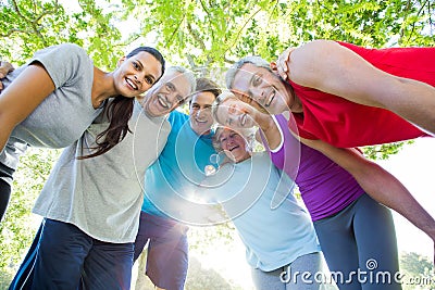 Happy athletic group looking down at the camera Stock Photo