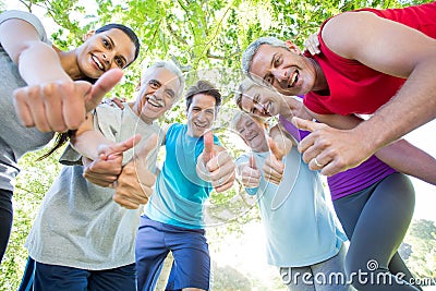 Happy athletic group with thumbs up Stock Photo