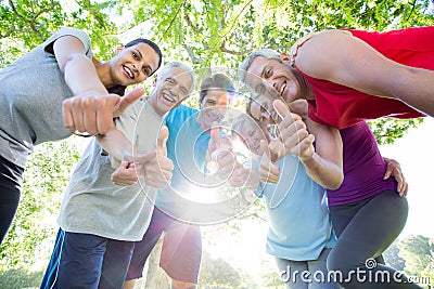 Happy athletic group with thumbs up Stock Photo