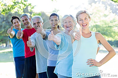 Happy athletic group with thumbs up Stock Photo