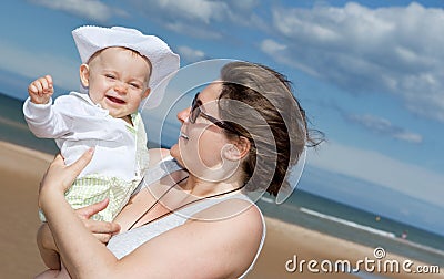 Happy baby at the beach. Stock Photo