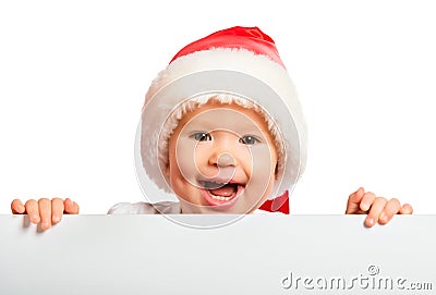 Happy baby in a Christmas hat and a blank billboard isolated on Stock Photo