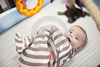 Happy baby in crib Stock Photo