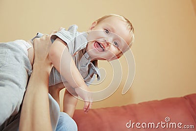 Happy baby flying in father arm closeup portrait Stock Photo