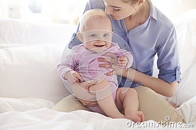 Happy baby girl with mom Stock Photo