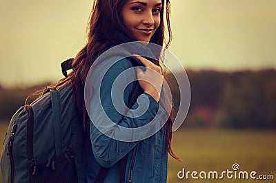 Happy backpacking adventurous woman have a camping trip with blu Stock Photo
