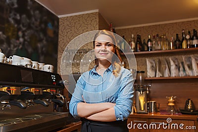 Happy barista woman at coffee shop Stock Photo