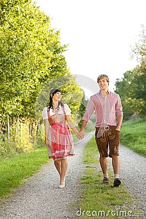 Happy bavarian couple in the evening sun Stock Photo