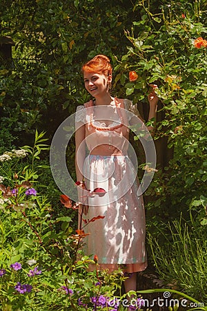 Happy Bavarian girl in your garden Stock Photo