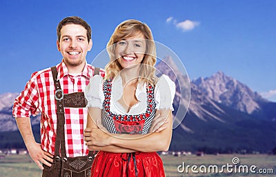 Happy bavarian man with leather pants and beautiful blonde woman Stock Photo