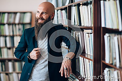 Happy bearded man portrait in library Stock Photo