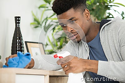 happy bearded man cleaning flat Stock Photo