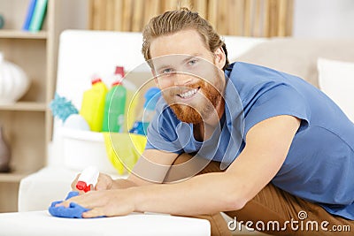 happy bearded man cleaning flat Stock Photo