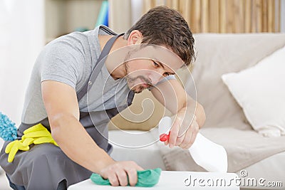 happy bearded man cleaning table Stock Photo