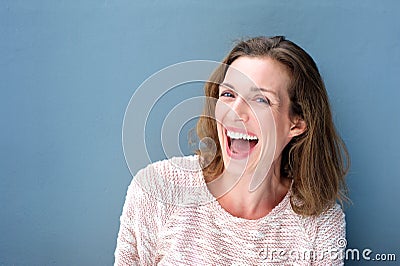 Happy beautiful fresh mid adult woman laughing Stock Photo