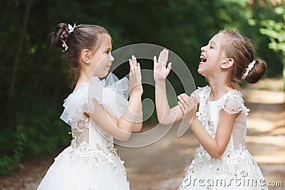 Happy beautiful girls with white wedding dresses Stock Photo