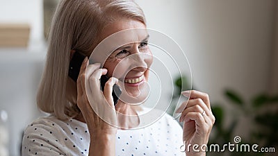 Happy beautiful mature woman making phone call close up Stock Photo