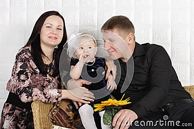 Happy beautiful mother, father and daughter. Stock Photo