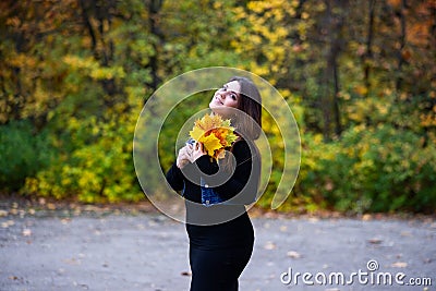 Happy beautiful woman in autumn, cute plus size model outdoors Stock Photo