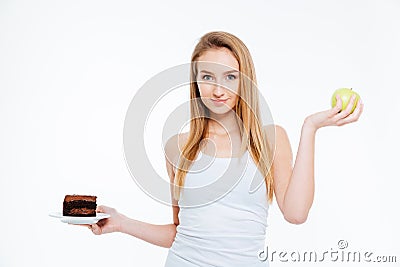 Happy beautiful woman holding chocolate cake and green apple Stock Photo