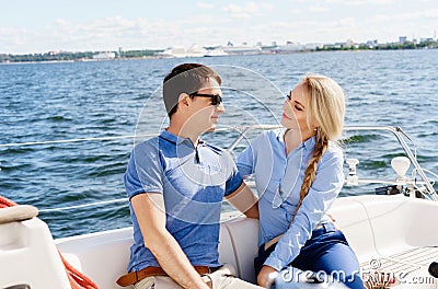 Happy and beautiful young couple having a rest on a yacht. Traveling, tourism, journey, concept. Stock Photo