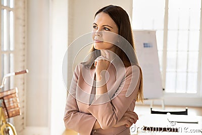 Happy beautiful young startup manager girl standing in office Stock Photo
