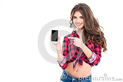 Happy beautiful young woman holding blank screen mobile phone Stock Photo