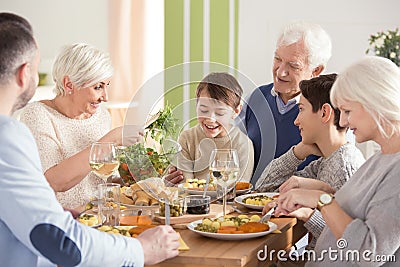 Happy big family eating dinner Stock Photo