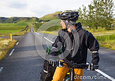 Happy biker on backdrop of mountains in Iceland Stock Photo