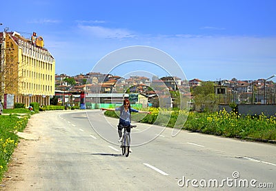 Happy biker woman balancing Stock Photo