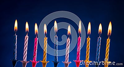 Happy birthday candles over blue Stock Photo