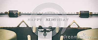 HAPPY BIRTHDAY in capital letters on a typewriter sheet Stock Photo