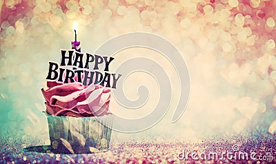 Happy birthday cupcake on glitter colorful background Stock Photo