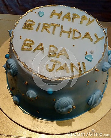 Happy Birthday Dad Cake. Beautifully Decorated cake on golden table. Stock Photo